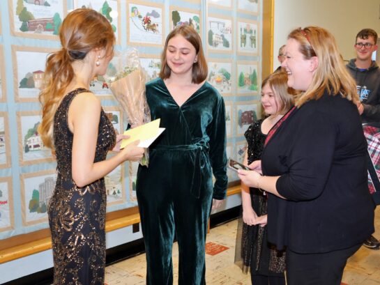 Girls gave flowers to Jasmine at the reception after the concert {{brizy_dc_image_alt imageSrc=