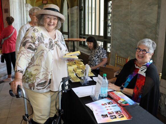 Ladies at welcome table {{brizy_dc_image_alt imageSrc=