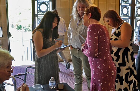 Group of people at the reception after the recital {{brizy_dc_image_alt imageSrc=