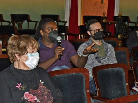 Audience member asks a question